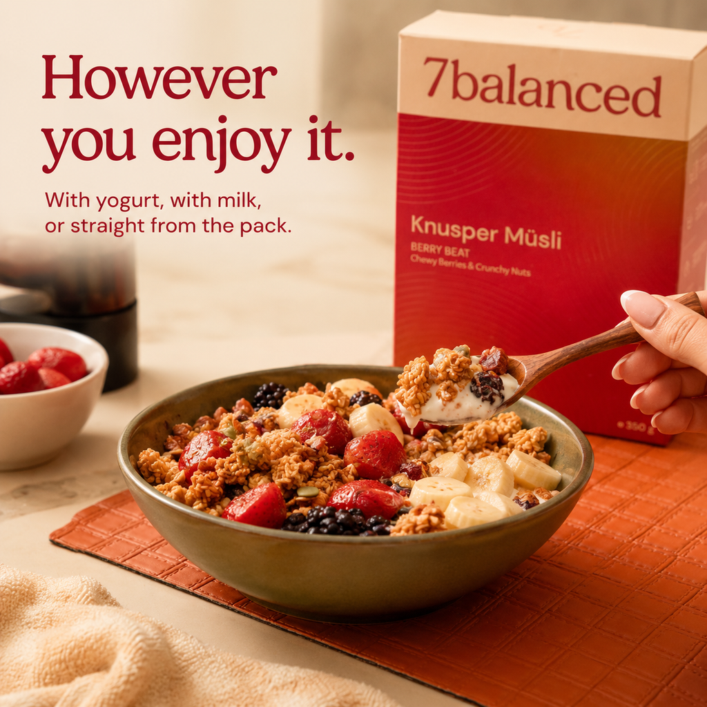 Berry granola bowl with strawberries and spoon, plus product box