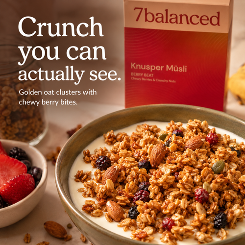 Granola bowl with berry bits and nut pieces, with product box in view