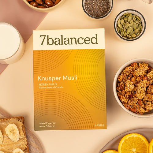 7balanced Honey Halo granola bag with bowls of almonds and pumpkin seeds
