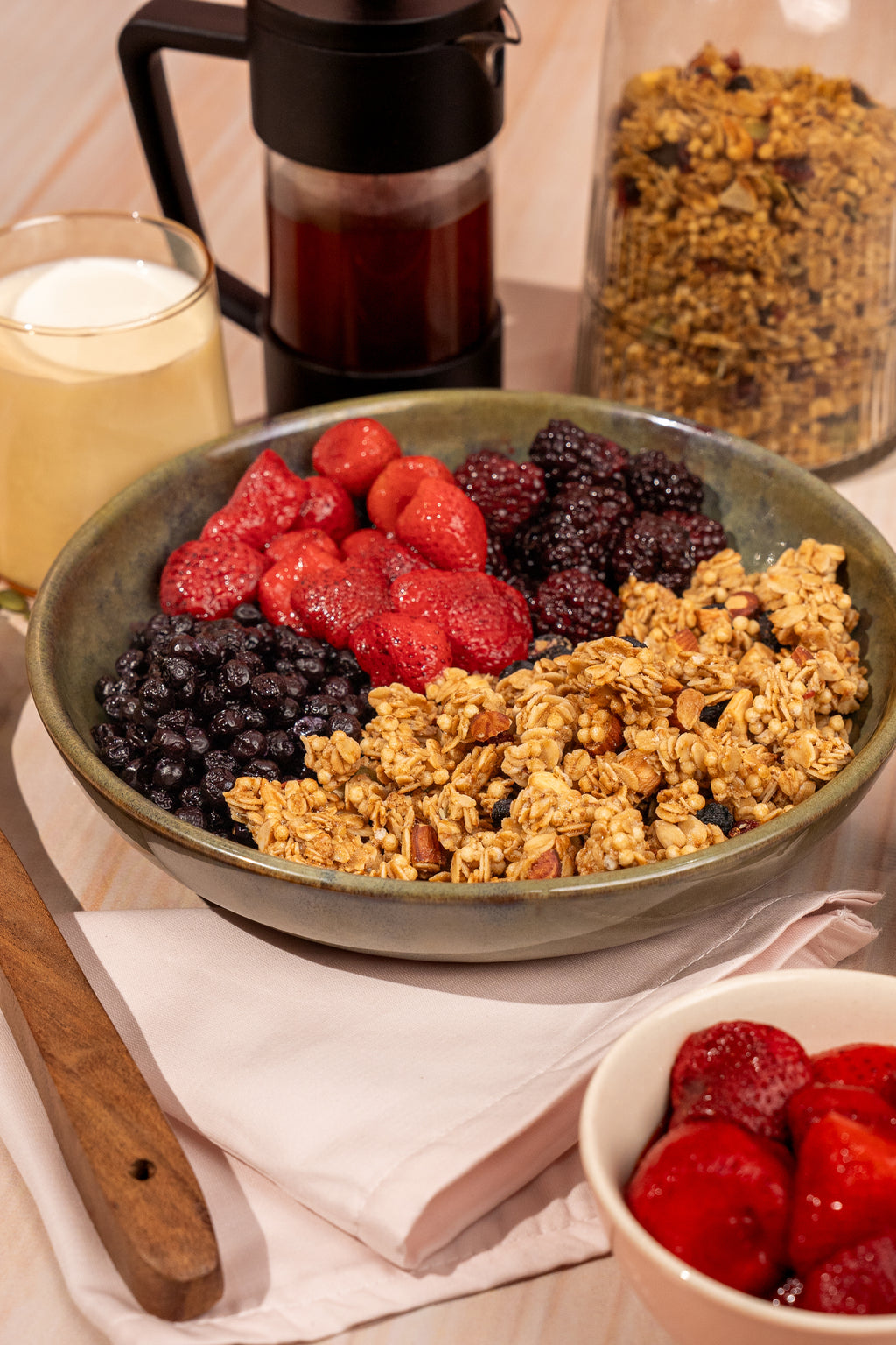 Granola bowl with strawberries, blackberries, and oat clusters